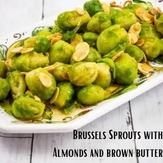 brussels sprouts with almonds and brown butter on a rectangular platter