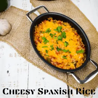 cheesy baked spanish rice in an oval serving container