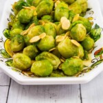 brussels sprouts with brown butter and almonds in a serving bowl