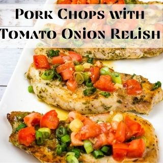 Pork chops with tomato-onion relish on a white serving platter