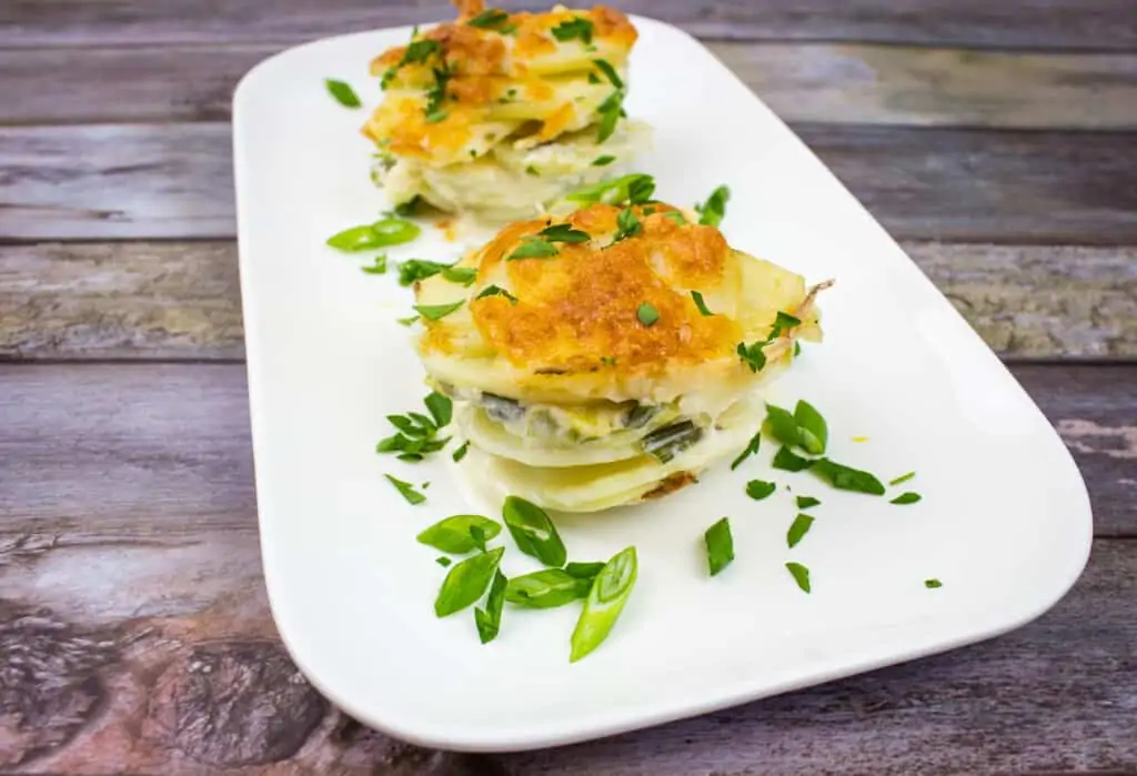 Au Gratin Potato Stacks on a white plate.