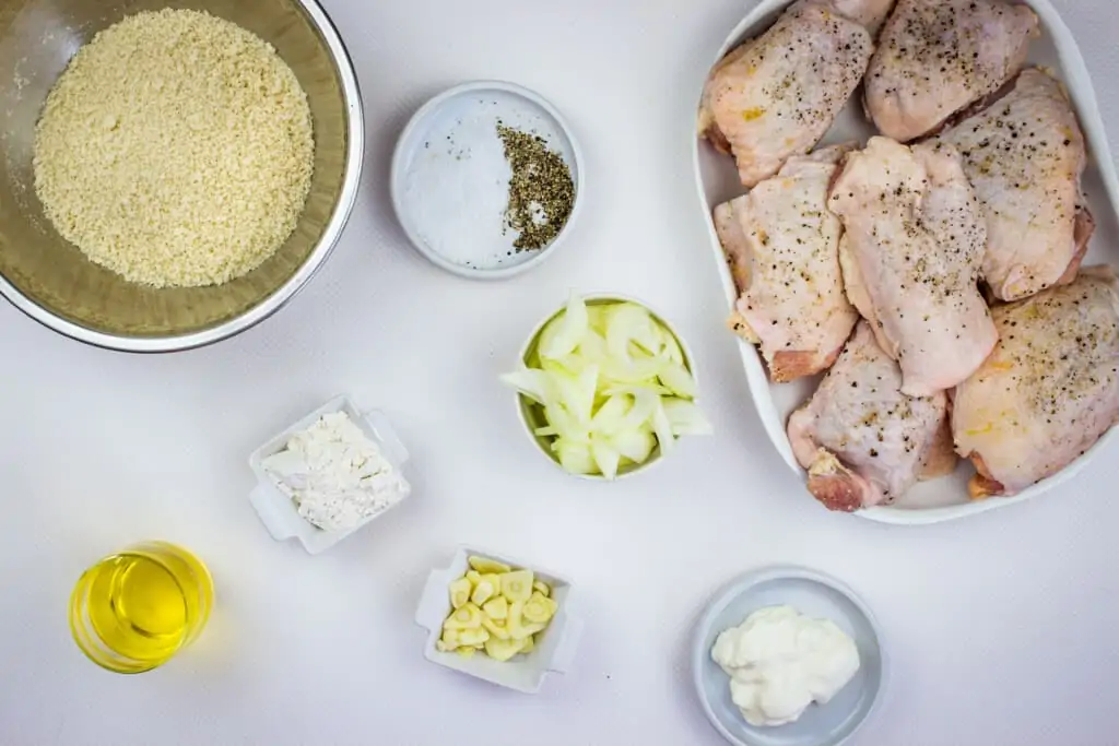 prepped ingredients to make oven baked chicken thighs with onion gravy