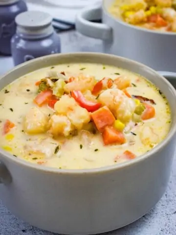 shrimp & corn chowder with chipotle in a bowl with a second serving in the background