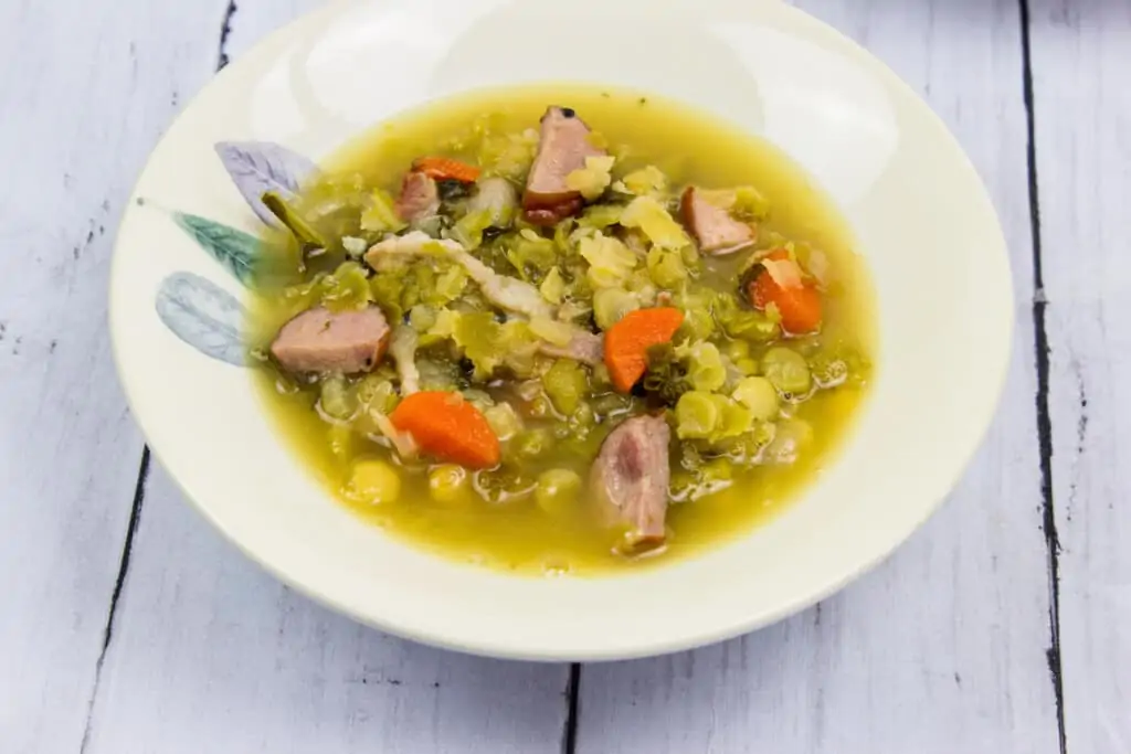 split pea, ham and sausage soup in a bowl