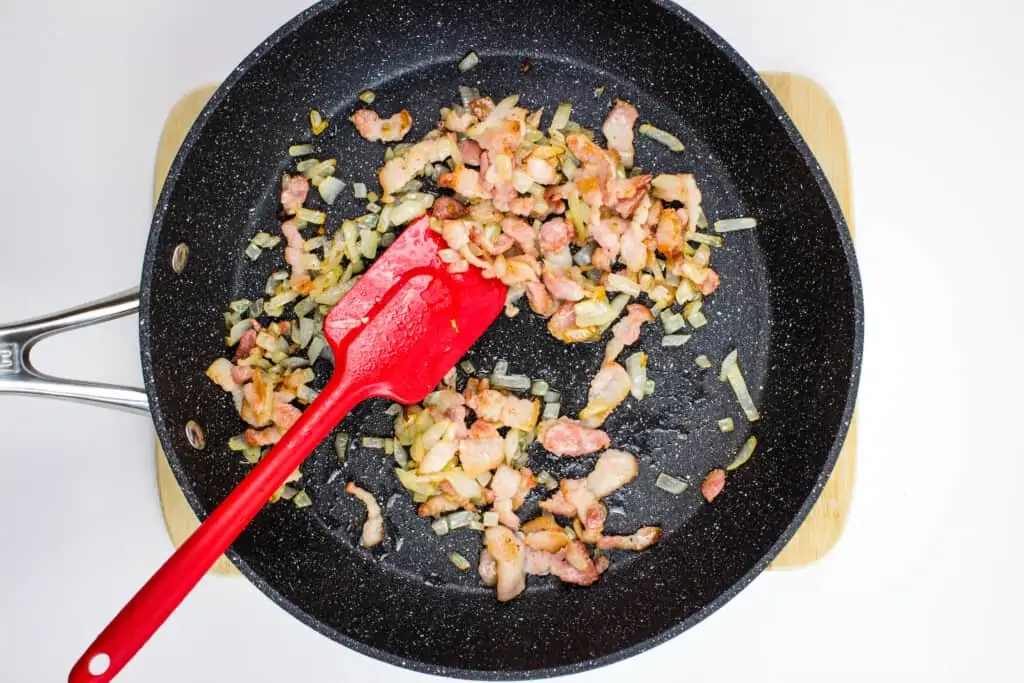 pan frying the bacon, onions, garlic, and jalapeno