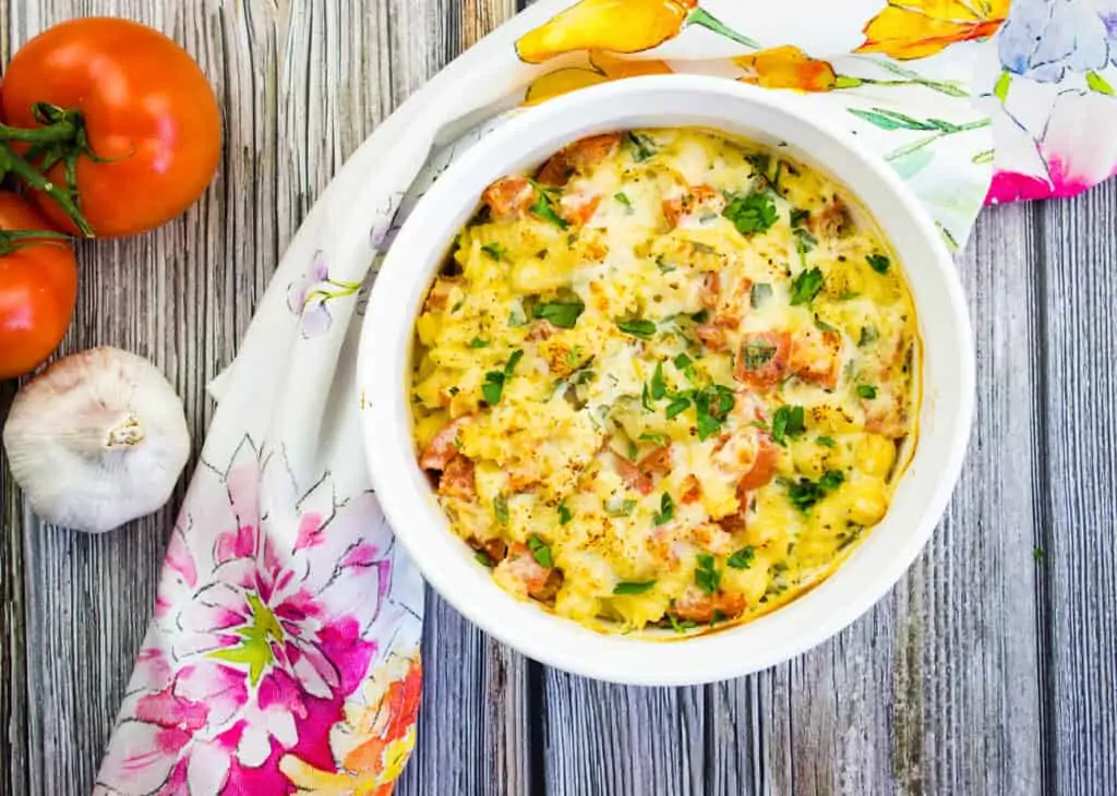 Baked pasta with ricotta and tomatoes in a casserole dish