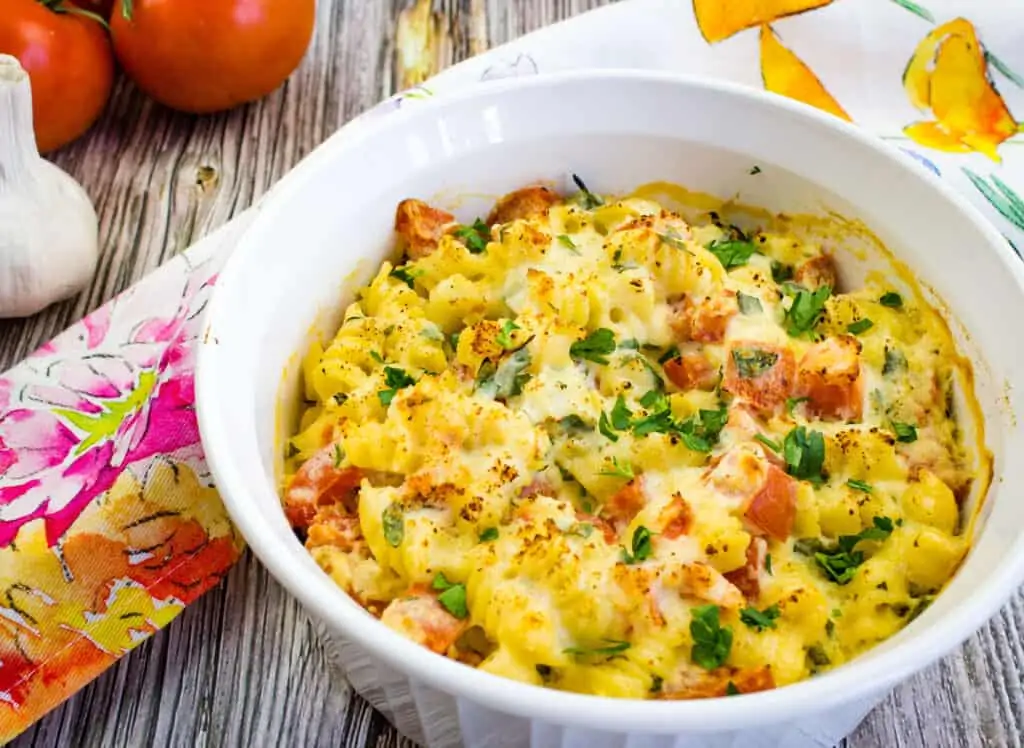 Baked pasta with ricotta and tomatoes in a casserole dish