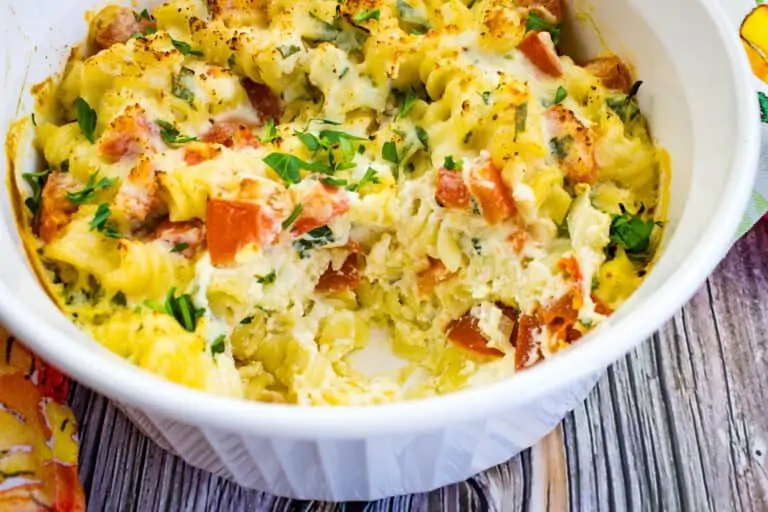 Creamy cheesy baked pasta with ricotta and tomatoes.