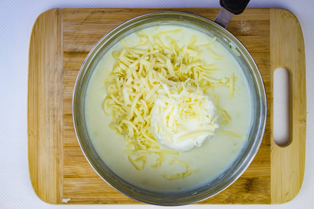 cheeses added to the sauce that's been cooked with milk
