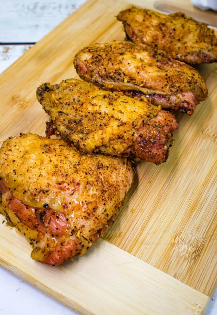 smoked chicken thighs on a cutting board