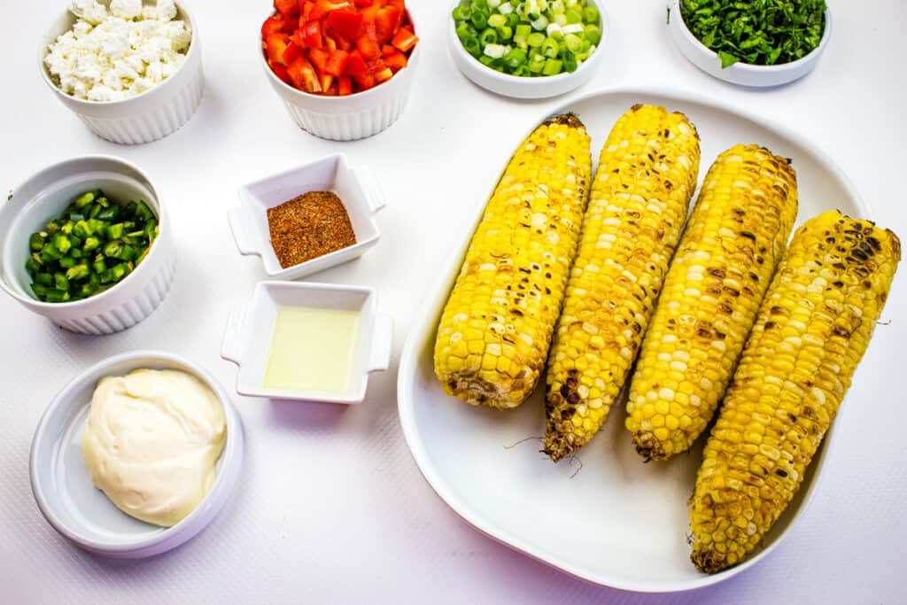 Prepped ingredients to make easy street corn salad recipe