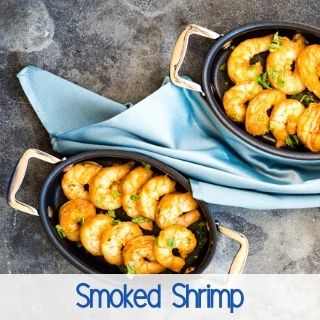 smoked shrimp in small black dishes