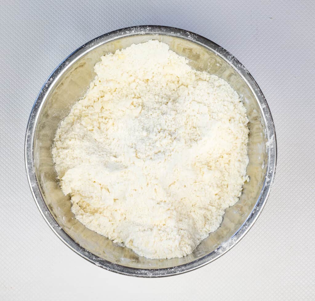 cutting the butter into the flour mixture