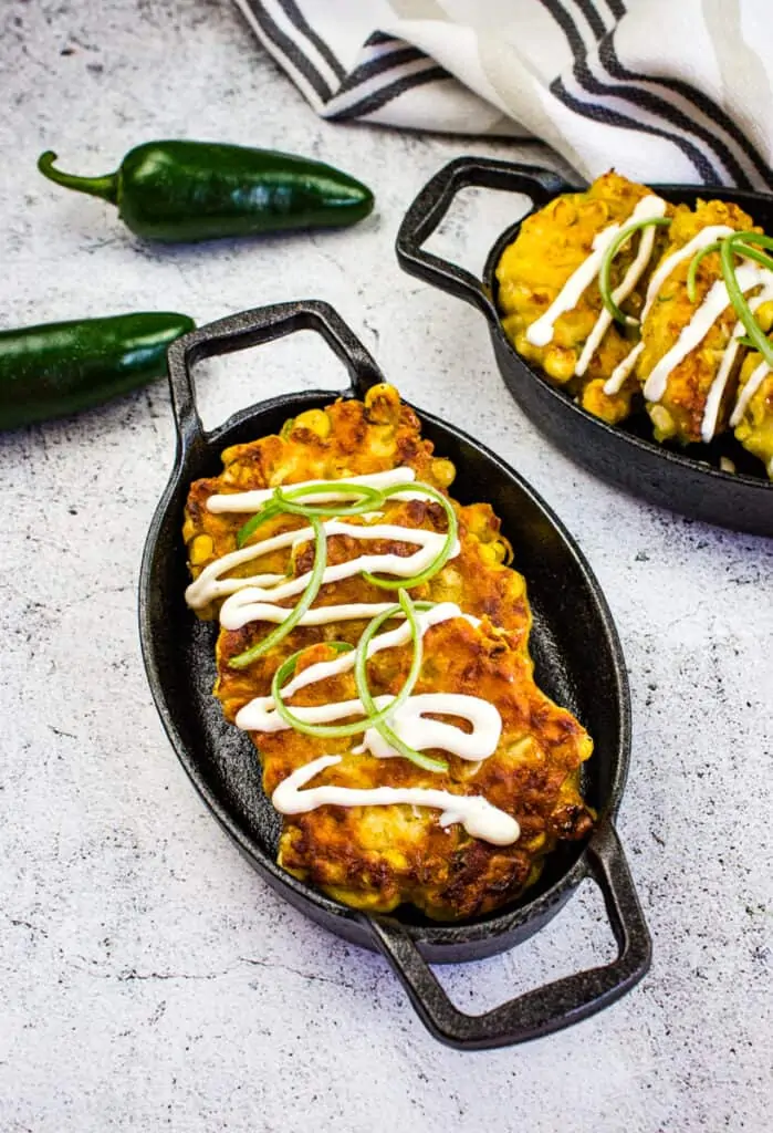 easy corn fritters in a black serving dish