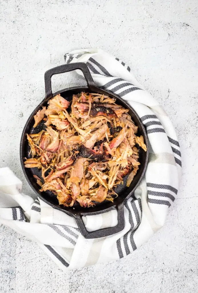 smoked pulled pork in a black dish