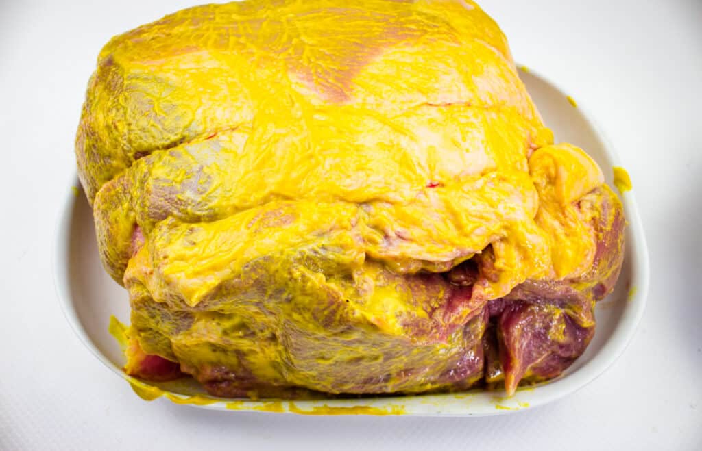 pork butt rubbed with mustard