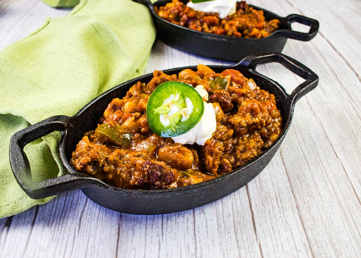 Over the Top Chili in a black cast iron bowl.