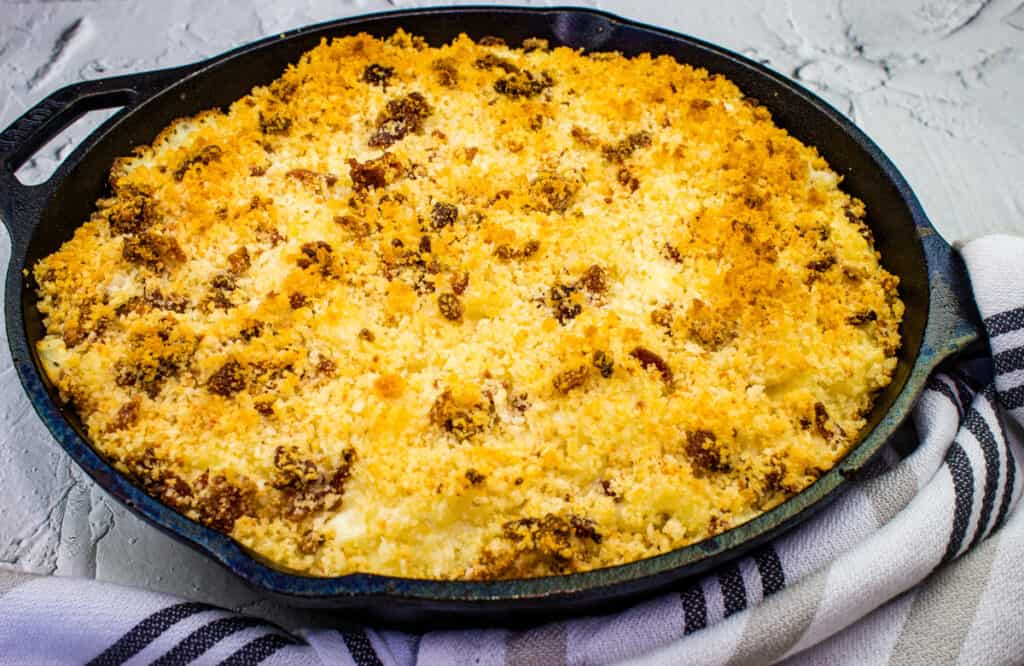 Smoked mac and cheese with bacon crumb topping in a baking dish.