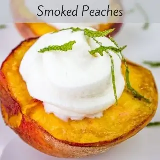 a closeup of a smoked peach on a plate.