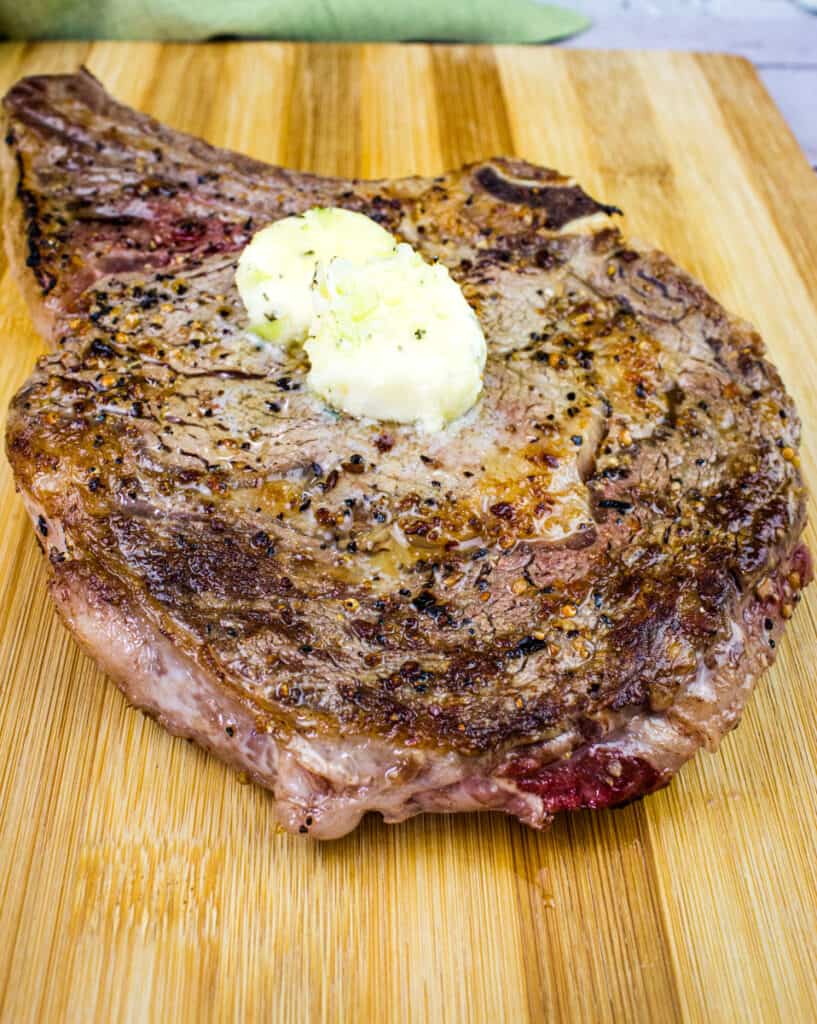 steak on a blackstone griddle cooked with butter on top