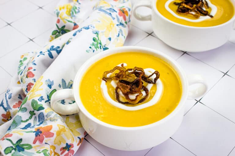 Cauliflower and sweet potato soup in a bowl.