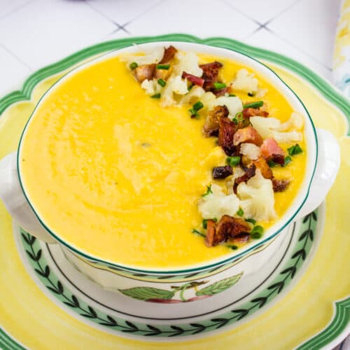 Cream of sweet potato and cauliflower soup in a bowl.