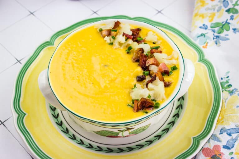 Cream of sweet potato and cauliflower soup in a bowl.
