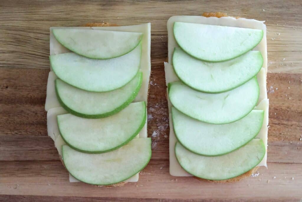 adding thinly sliced apples