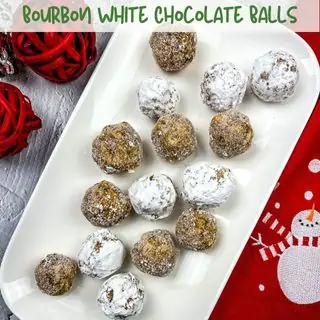 Bourbon white chocolate balls on a white platter.