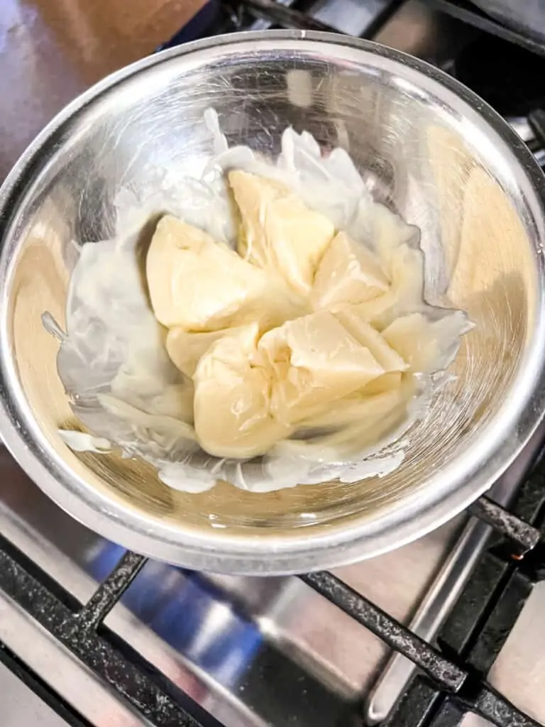 Melting white chocolate in a double boiler for cranberry bars