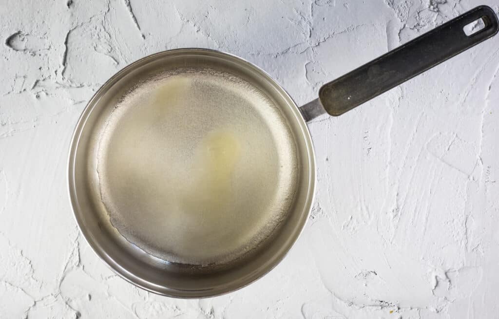 dissolving gelatin in water in a pot