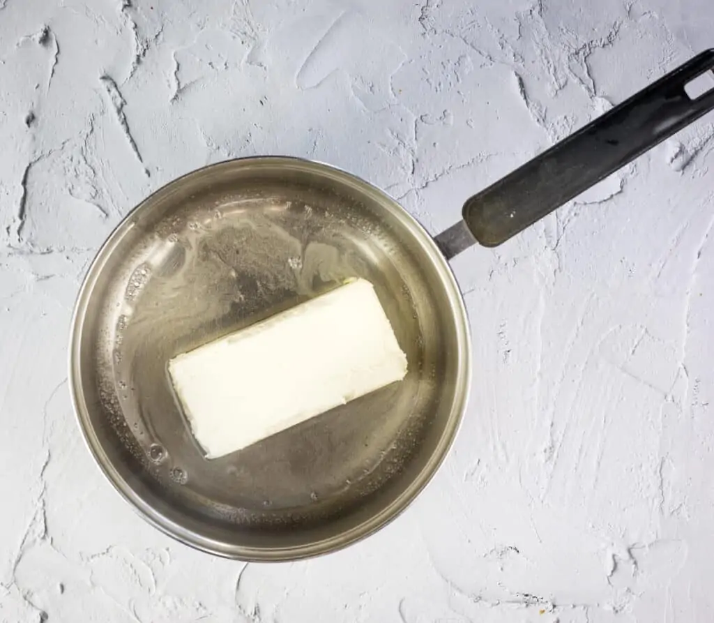 melting the cream cheese in gelatin to make cold crab dip