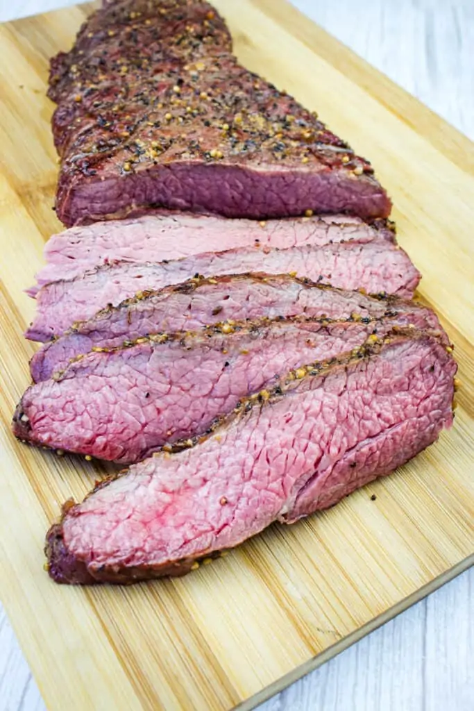 cut tri tip on a cutting board