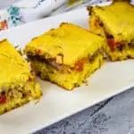 Pulled Pork Stuffed Cornbread served on a white plate.