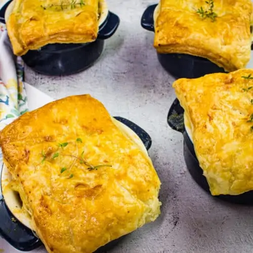 Turkey Pot Pies with Puff Pastry on a counter.