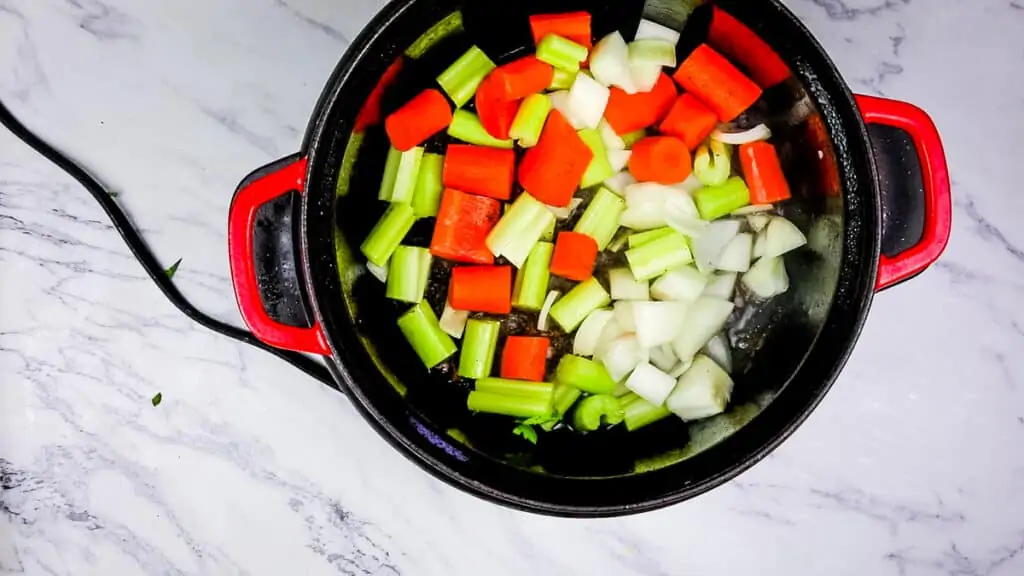 sauteing the vegetables to make garlic braised short ribs