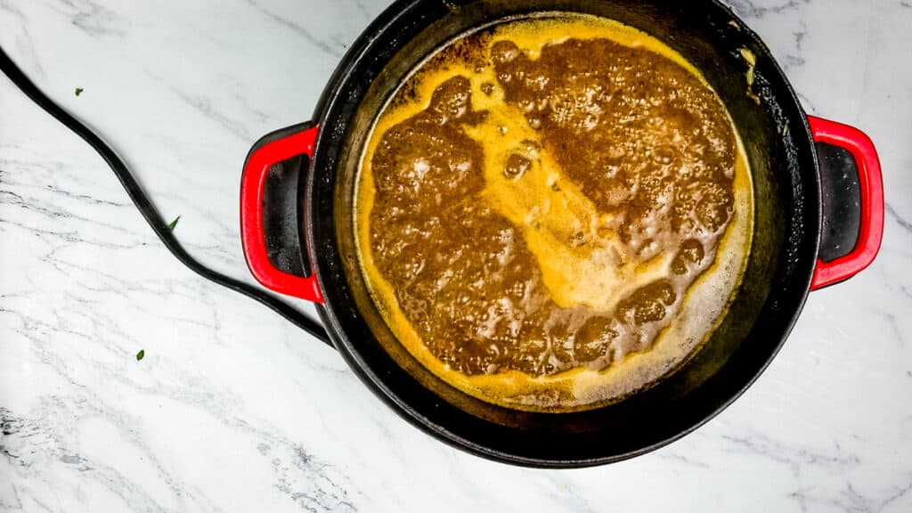 Remove the solids and thicken the gravy.