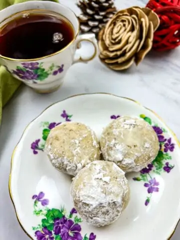 butter pecan balls with a cup of tea