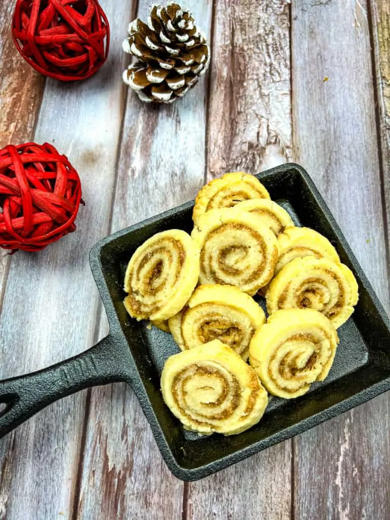 cinnamon roll cookies on a black cast iron dish