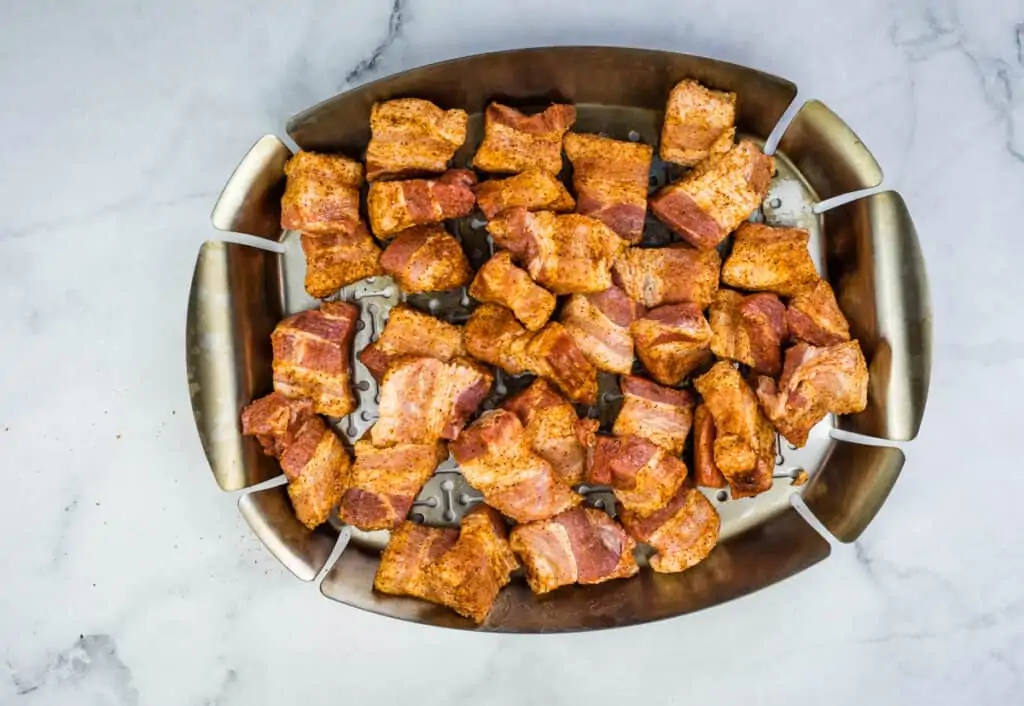 pork belly cubes on a grill pan