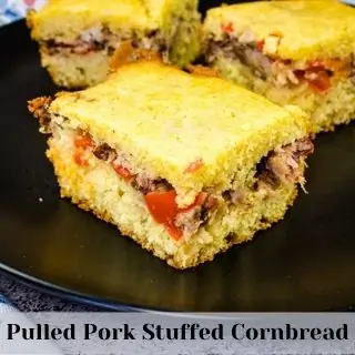 pulled pork stuffed cornbread on a black plate