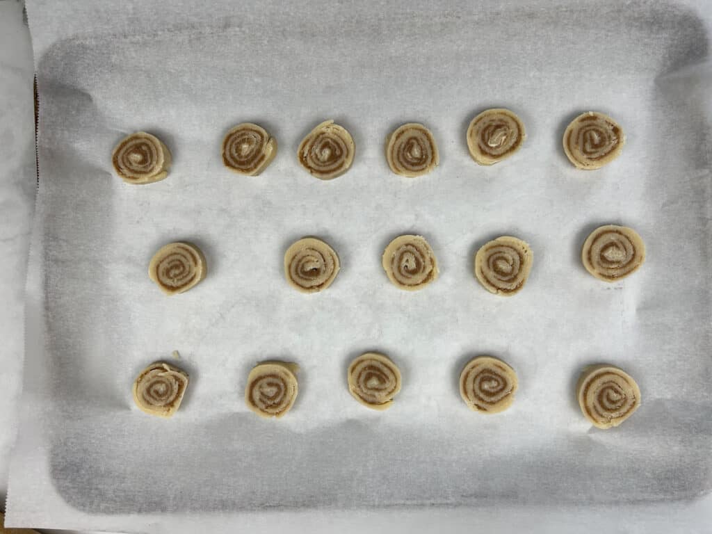 cinnamon roll cookie dough on a sheet pan
