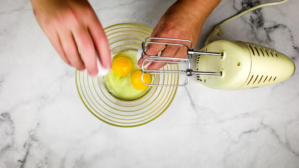 whip the eggs with a hand beater