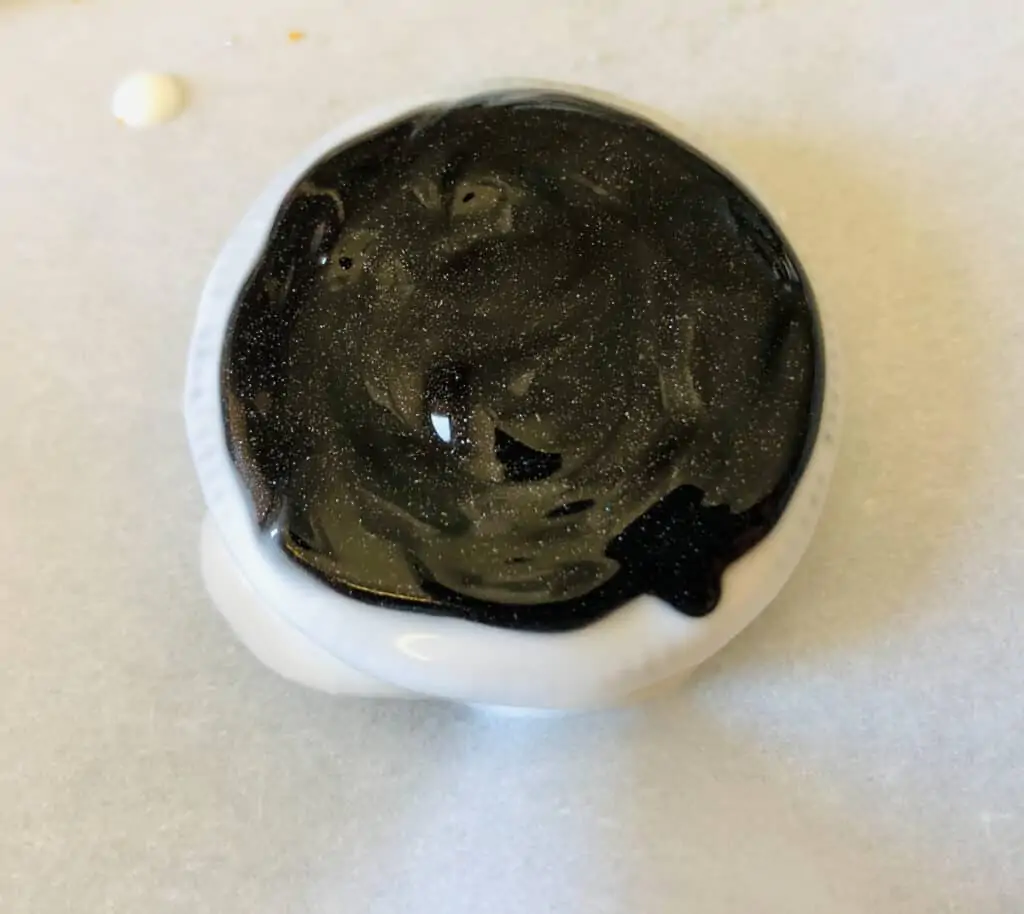 a cookie with black icing to change the clock face color