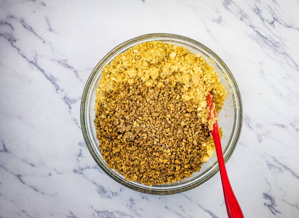 Add the toasted chopped nuts to the bourbon ball dough.