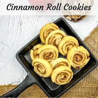 cinnamon roll cookies on a black tray