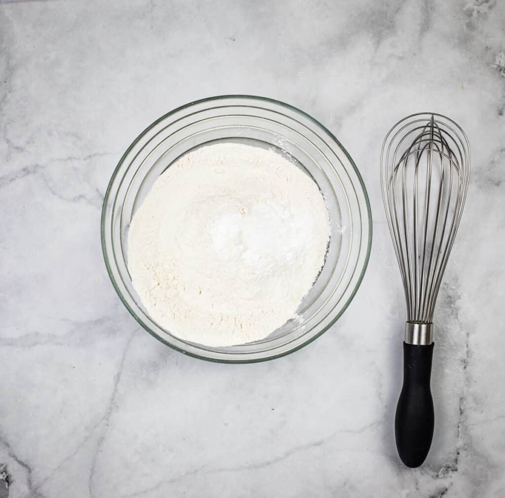 Flour, salt, and baking powder in a bowl.