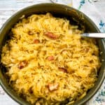 Oven Baked Sauerkraut with Bacon and Apples in a serving dish