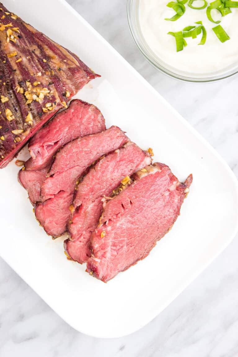 smoked beef tenderloin sliced on a platter