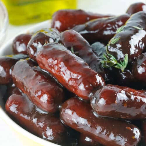 Smoked little smokies in a serving bowl.